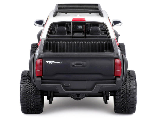 2023 Toyota Tacoma TRD PRO Off Road Pickup Truck White with Graphics and Roof Rack "Maisto Design" Series 1/27 Diecast Model Car Maisto by Maisto