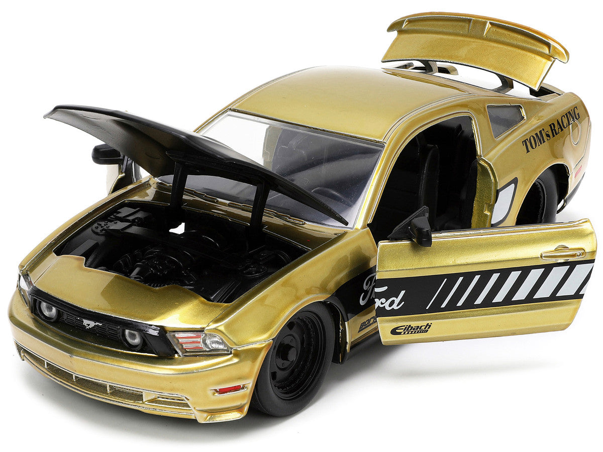 2010 Ford Mustang GT Gold Metallic with Black Graphics and Hood "Tom's Racing" "Bigtime Muscle" Series 1/24 Diecast Model Car by Jada by Jada
