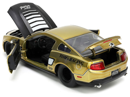 2010 Ford Mustang GT Gold Metallic with Black Graphics and Hood "Tom's Racing" "Bigtime Muscle" Series 1/24 Diecast Model Car by Jada by Jada