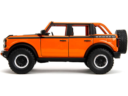 2021 Ford Bronco Open-Top Orange with Black Stripes and Hood with Extra Wheels "Just Trucks" Series 1/24 Diecast Model Car by Jada by Jada