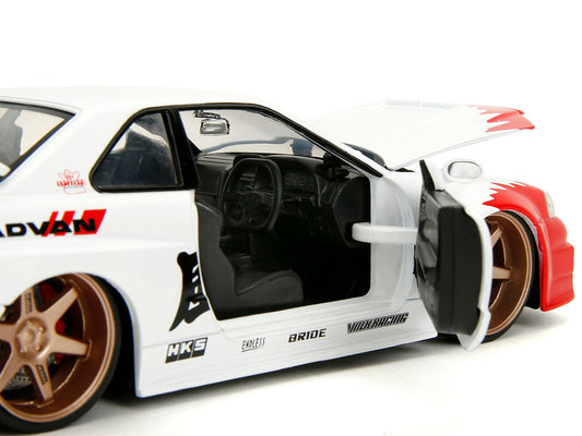 2002 Nissan Skyline GT-R (R34) RHD (Right Hand Drive) White with Red Graphics and Ryu Diecast Figure "Street Fighter" Video Game "Anime Hollywood Rides" Series 1/24 Diecast Model Car by Jada by Jada