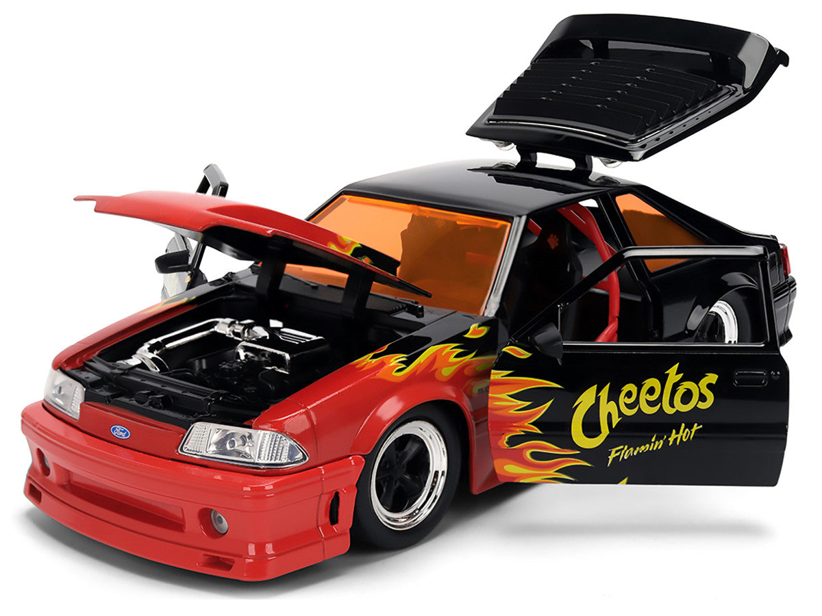 1989 Ford Mustang GT Black with Red Flame Graphics and Chester Cheetah Diecast Figure "Cheetos Flamin' Hot" "Hollywood Rides" Series 1/24 Diecast Model Car by Jada by Jada