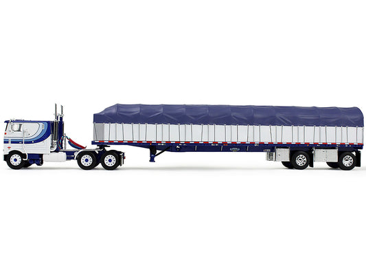 Peterbilt 352 COE 110" Sleeper and 53’ Wilson Roadbrute Flatbed Trailer with Covered Wagon White with Blue Stripes 1/64 Diecast Model by DCP/First Gear by First Gear