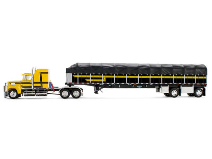 Ford LTL 9000 with 60" Aerodyne Sleeper and 53' Wilson Roadbrute Flatbed Trailer with Covered Wagon Yellow with Black Stripes 1/64 Diecast Model by DCP/First Gear by First Gear