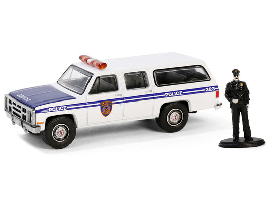 1985 GMC Suburban 2500 "New York City Transit Police Department" White with Blue Stripes and Police Officer Figure "The Hobby Shop" Series 16 1/64 Diecast Model Car by Greenlight by Greenlight