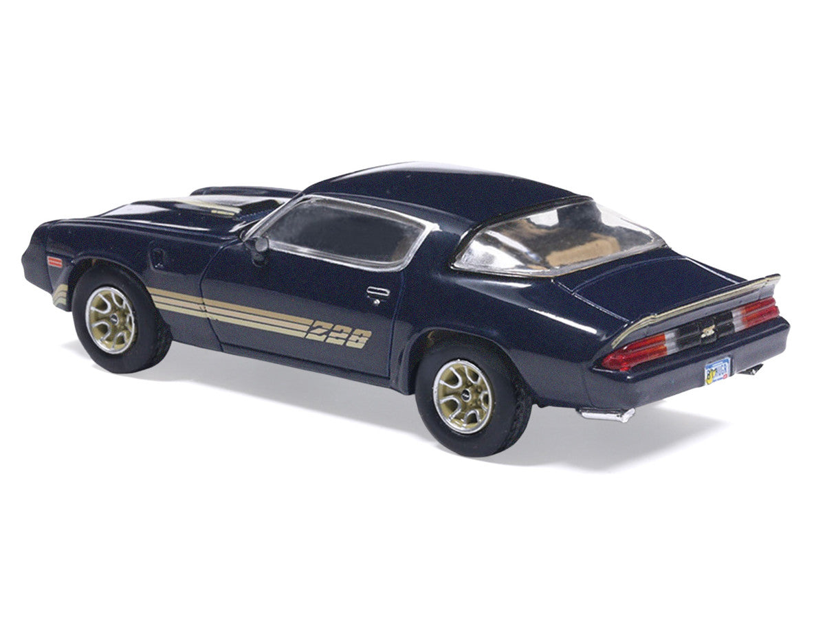 1981 Chevrolet Camaro Z28 Dark Blue Metallic with Gold Stripes and Interior 1/64 Diecast Model Car by IXO Models by IXO