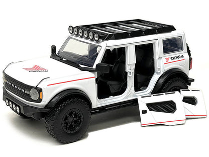 2021 Ford Bronco White with Red Stripes and Roof Rack "Yokohama Tires" "Just Trucks" Series 1/24 Diecast Model Car by Jada by Jada