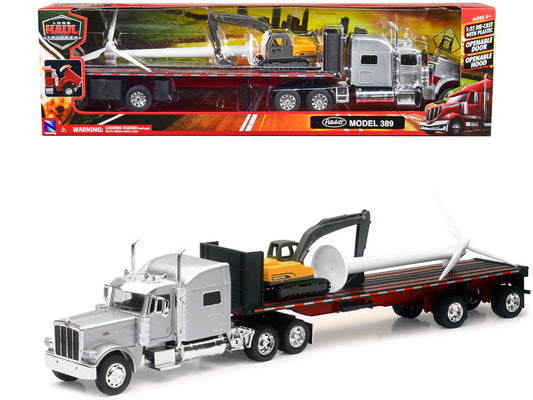 Peterbilt 389 Truck with Flatbed Trailer Silver Metallic with Excavator and Wind Turbine "Long Haul Truckers" Series 1/32 Diecast Model by New Ray by New Ray