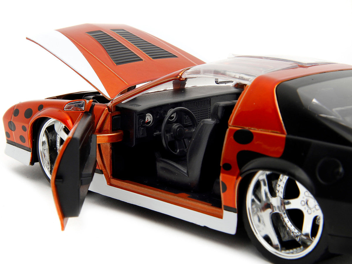1985 Chevrolet Camaro Z/28 Orange Metallic with Graphics and Chester Cheetah Diecast Figure "Cheetos" "Hollywood Rides" Series 1/24 Diecast Model Car by Jada by Jada