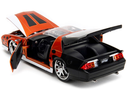 1985 Chevrolet Camaro Z/28 Orange Metallic with Graphics and Chester Cheetah Diecast Figure "Cheetos" "Hollywood Rides" Series 1/24 Diecast Model Car by Jada by Jada